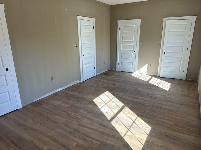 spare room featuring wood finished floors