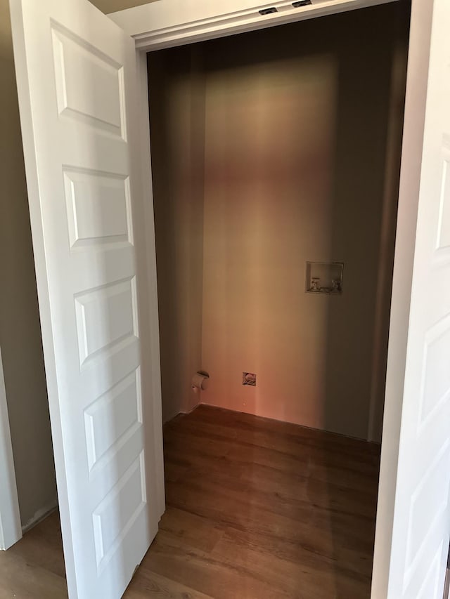 laundry room with light wood-style floors, hookup for a washing machine, and laundry area