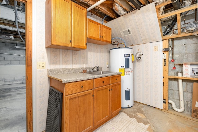 kitchen with electric water heater and sink