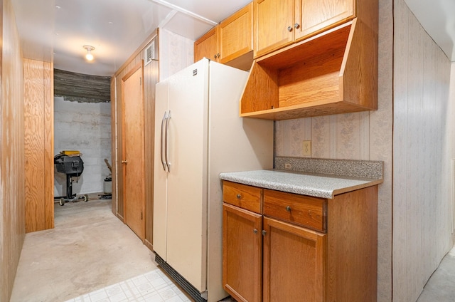 kitchen with white fridge with ice dispenser