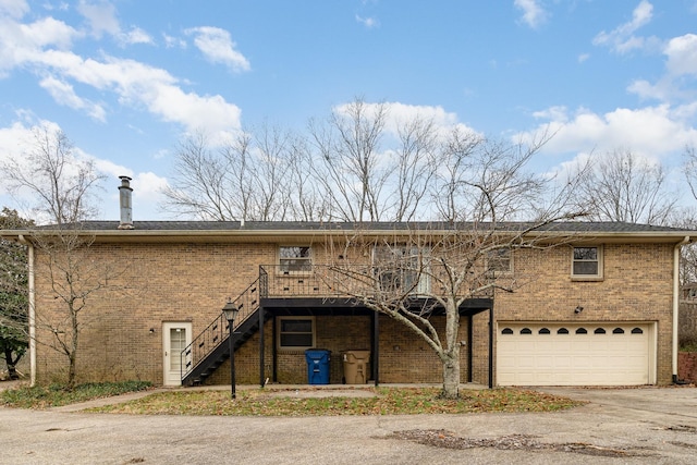 view of front of home with a wooden deck and a garage