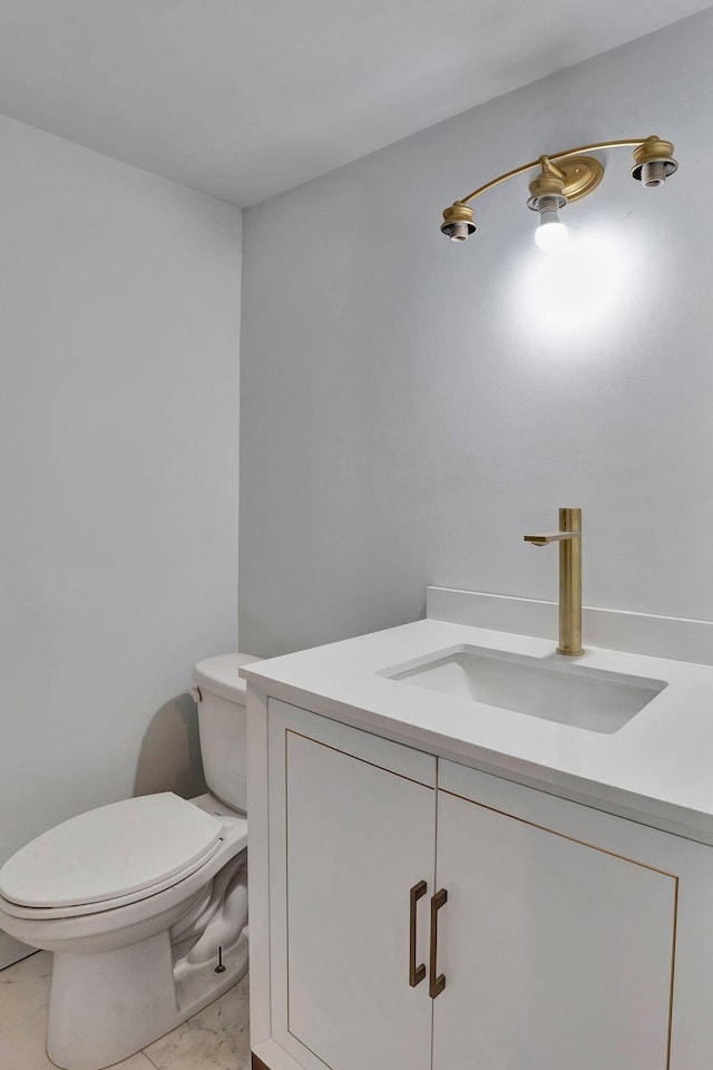 bathroom with tile patterned floors, vanity, and toilet