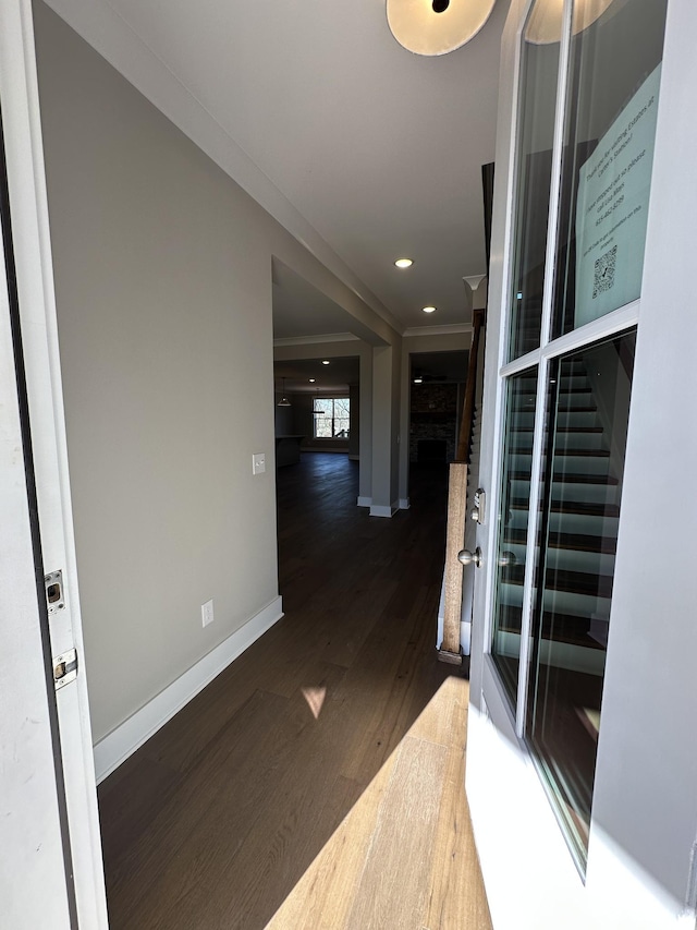 corridor with dark hardwood / wood-style flooring