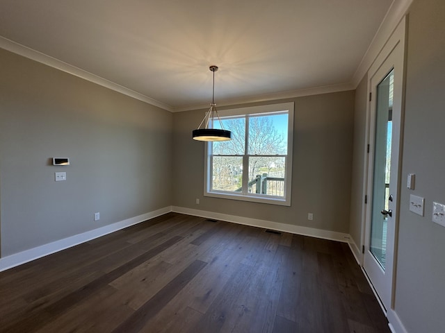 unfurnished dining area featuring dark hardwood / wood-style flooring and crown molding