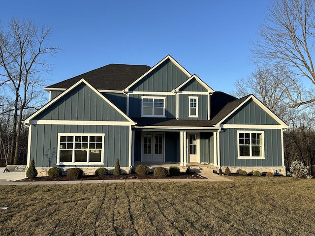 view of front of property with a front yard and covered porch