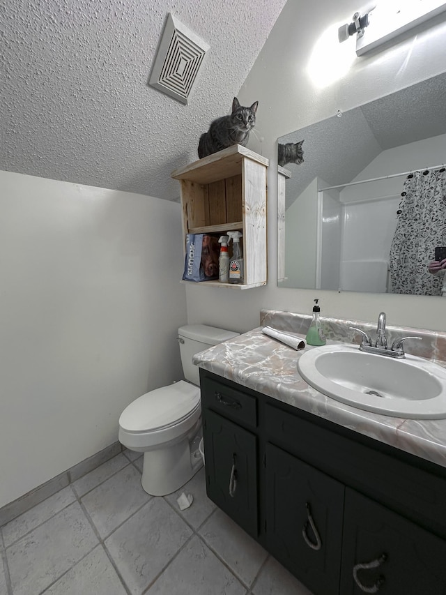 bathroom featuring a shower with curtain, tile patterned floors, vaulted ceiling, toilet, and vanity