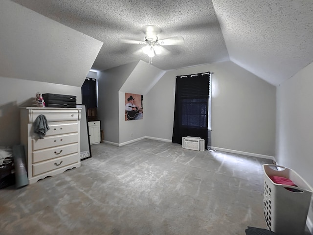 additional living space with ceiling fan, light colored carpet, lofted ceiling, and a textured ceiling