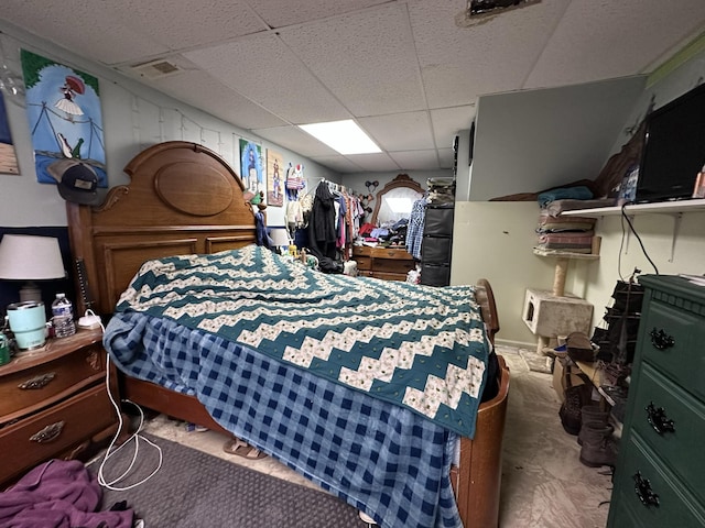 bedroom with a paneled ceiling