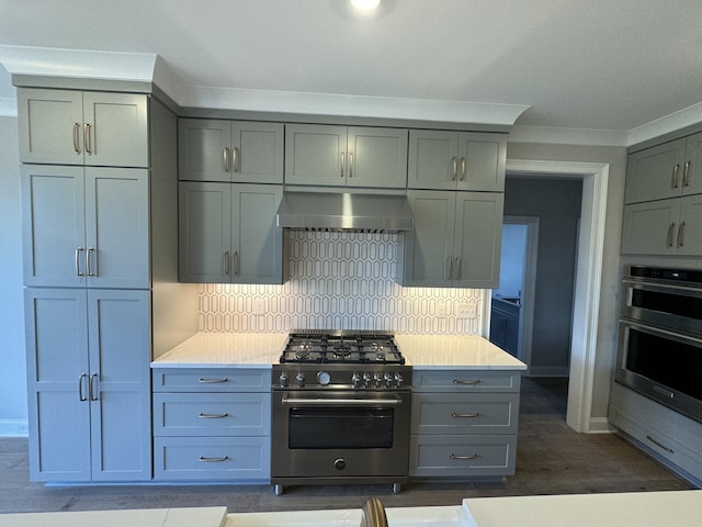 kitchen with decorative backsplash, stainless steel appliances, crown molding, exhaust hood, and dark hardwood / wood-style floors