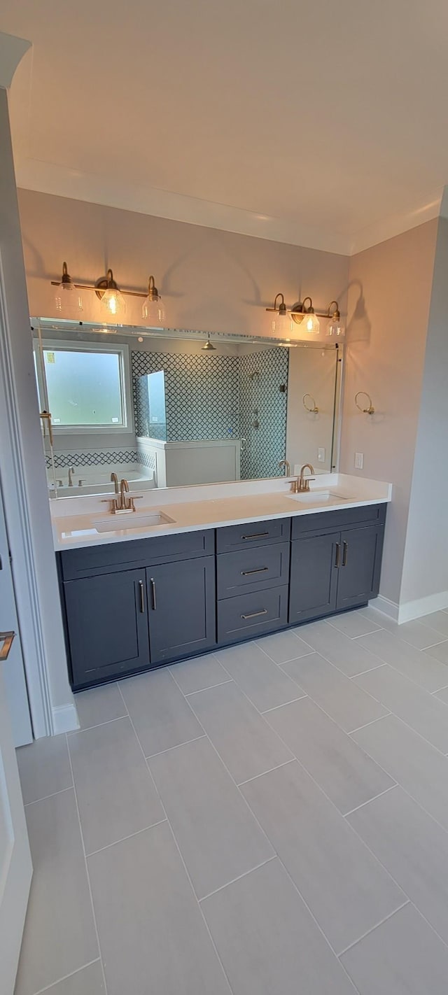 bathroom with tile patterned flooring and vanity