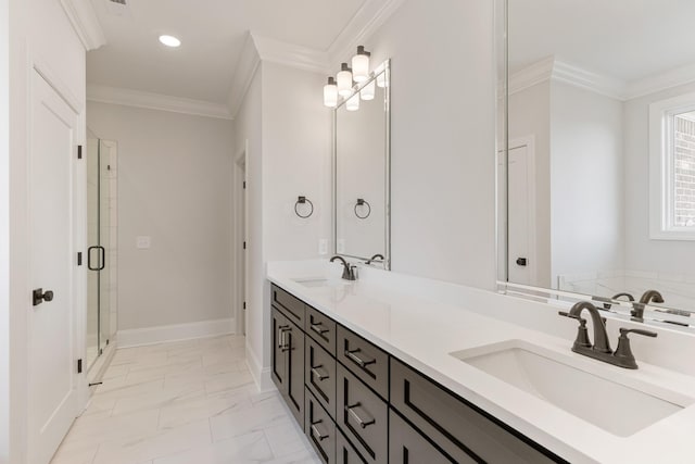 bathroom with vanity, a shower with door, and crown molding