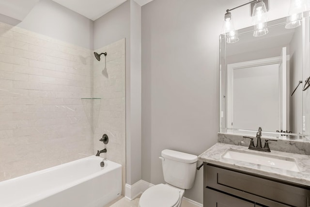 full bathroom featuring vanity, tiled shower / bath combo, and toilet