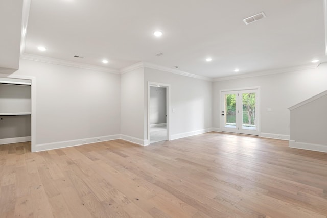 unfurnished room with light hardwood / wood-style flooring and ornamental molding