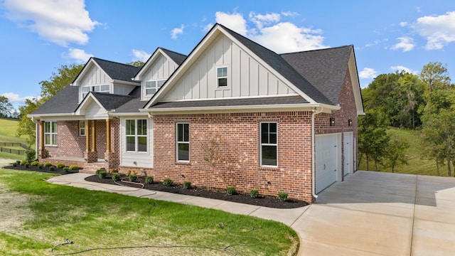 view of front of property with a garage and a front lawn