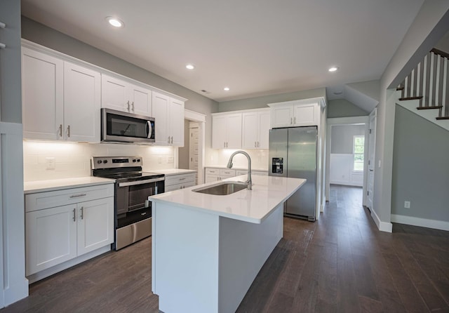 kitchen featuring dark hardwood / wood-style flooring, sink, white cabinetry, and stainless steel appliances