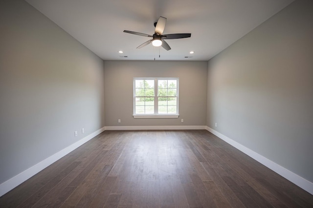 unfurnished room featuring dark hardwood / wood-style floors and ceiling fan