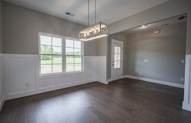 unfurnished room featuring dark hardwood / wood-style floors