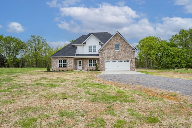 view of front of home featuring a garage and a front lawn