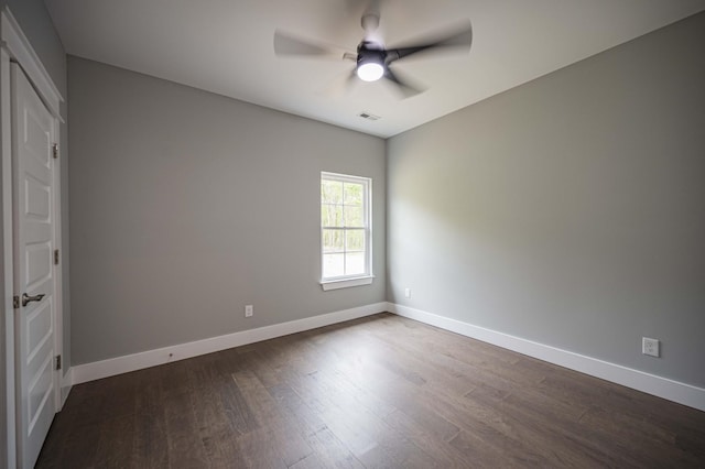 unfurnished bedroom featuring dark hardwood / wood-style flooring and ceiling fan