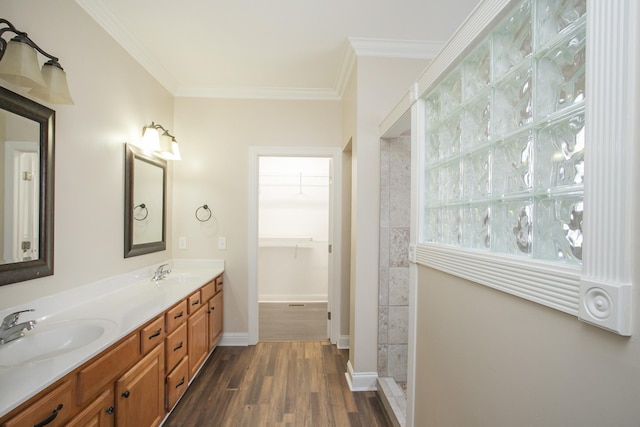 bathroom with vanity, ornamental molding, and hardwood / wood-style flooring