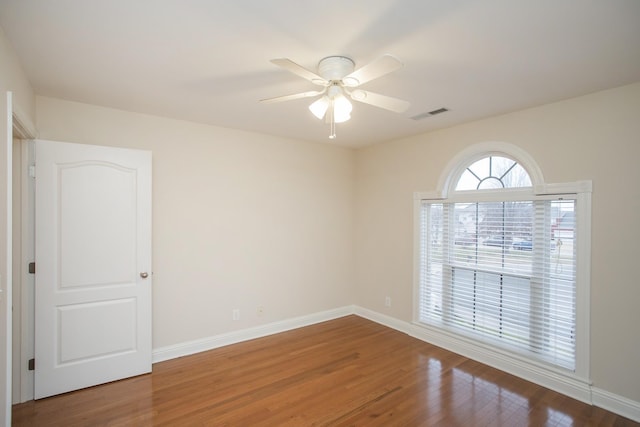 unfurnished room with hardwood / wood-style floors and ceiling fan