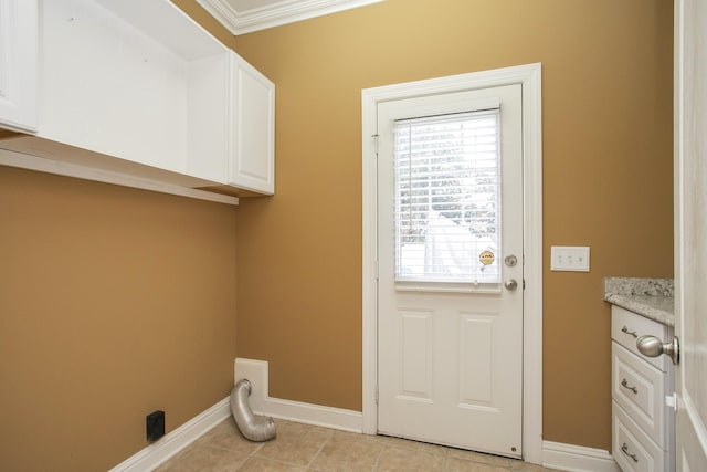 washroom featuring ornamental molding and light tile patterned flooring