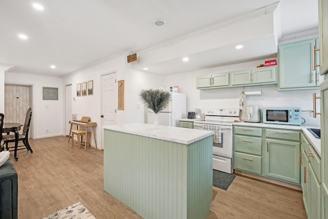 kitchen featuring green cabinets, crown molding, white appliances, a kitchen island, and light wood-type flooring