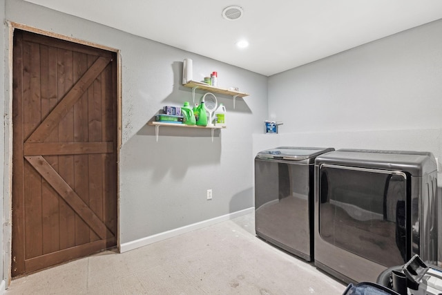 laundry room with washing machine and clothes dryer