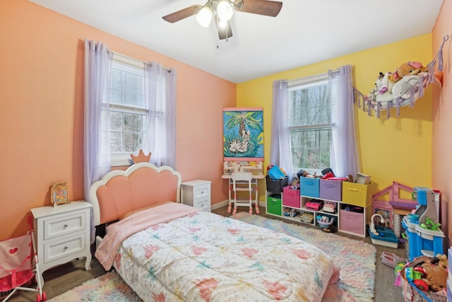 bedroom with hardwood / wood-style floors and ceiling fan