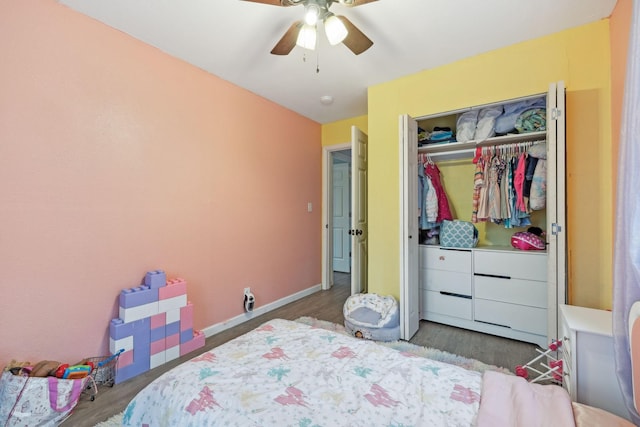 bedroom with wood-type flooring, a closet, and ceiling fan