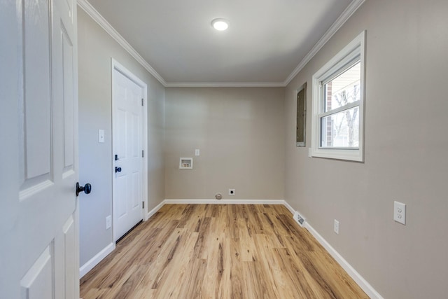 washroom featuring washer hookup, crown molding, and light hardwood / wood-style flooring