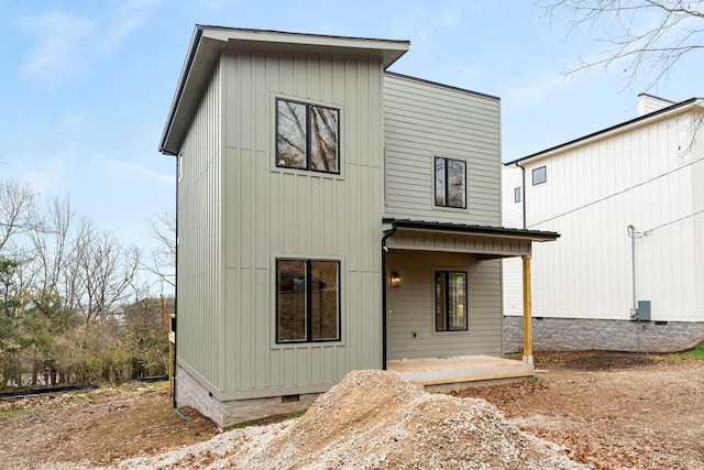 back of house with a patio area