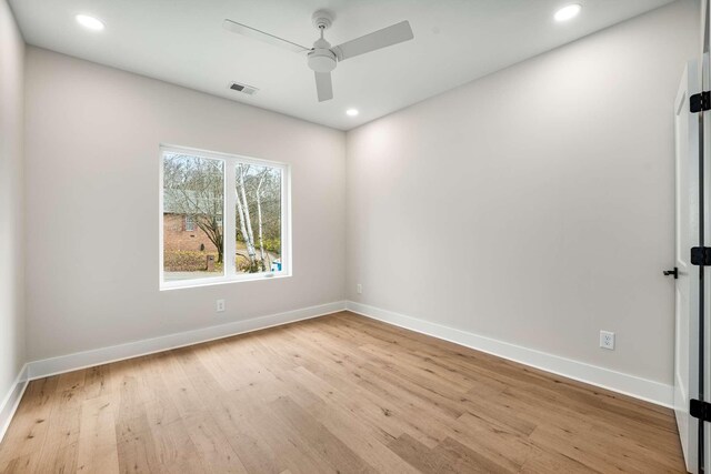 unfurnished room featuring ceiling fan and light hardwood / wood-style flooring