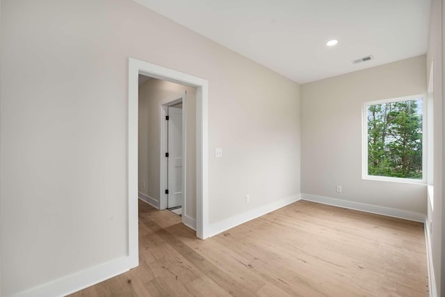 spare room featuring light hardwood / wood-style floors