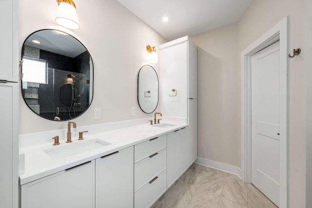 bathroom with vanity and a shower with shower door