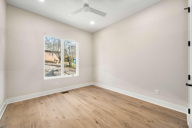 unfurnished room with light wood-type flooring and ceiling fan