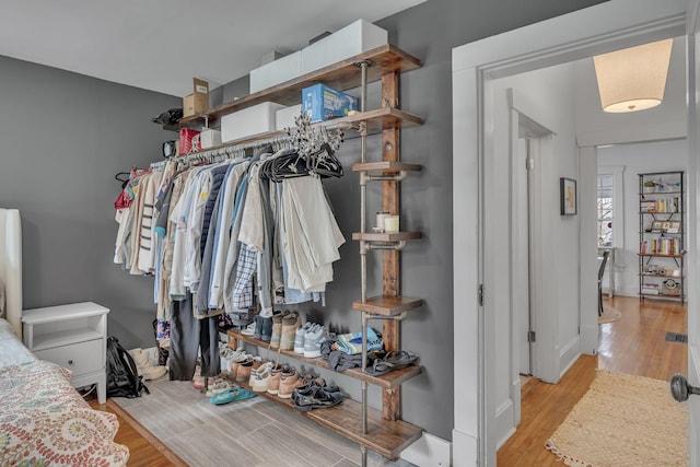 walk in closet featuring light hardwood / wood-style floors