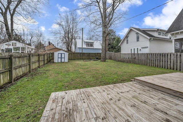 deck featuring a yard and a storage unit