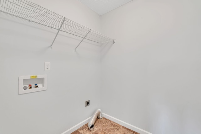 laundry room featuring hookup for an electric dryer, tile patterned floors, and washer hookup