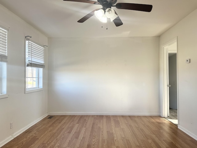 empty room with light wood-type flooring and ceiling fan