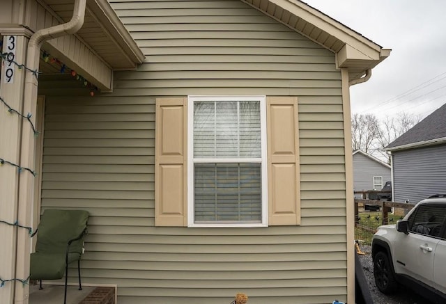 view of property exterior with fence