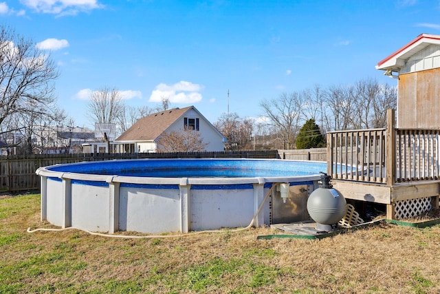 view of pool with a yard and a deck