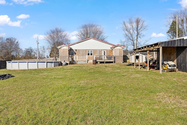 view of yard featuring a swimming pool side deck and a storage shed