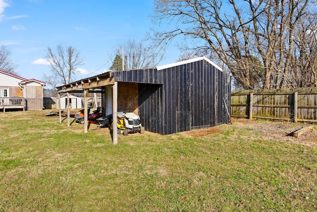 view of outdoor structure featuring a lawn