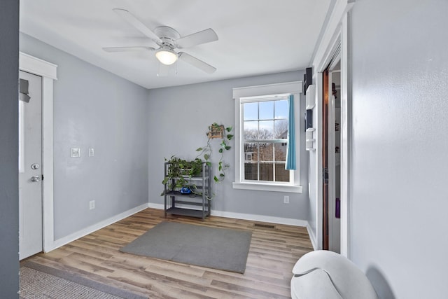 sitting room featuring ceiling fan and light hardwood / wood-style flooring