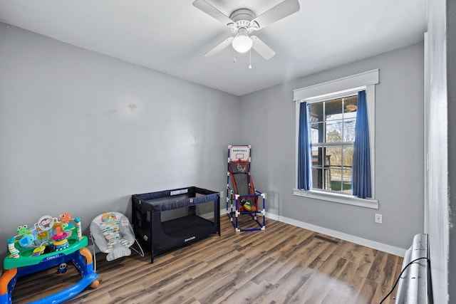 rec room featuring hardwood / wood-style floors and ceiling fan