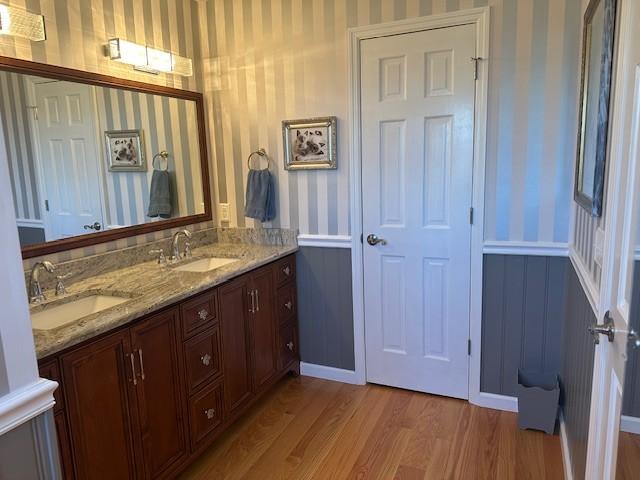 bathroom with vanity and hardwood / wood-style flooring