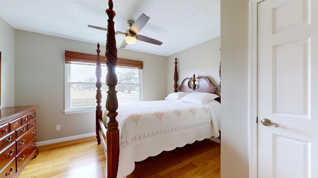 bedroom featuring ceiling fan and light hardwood / wood-style floors