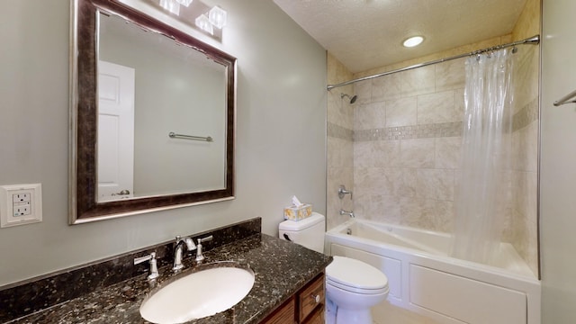 full bathroom with toilet, a textured ceiling, shower / tub combo, and vanity