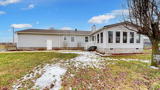 back of house with a yard